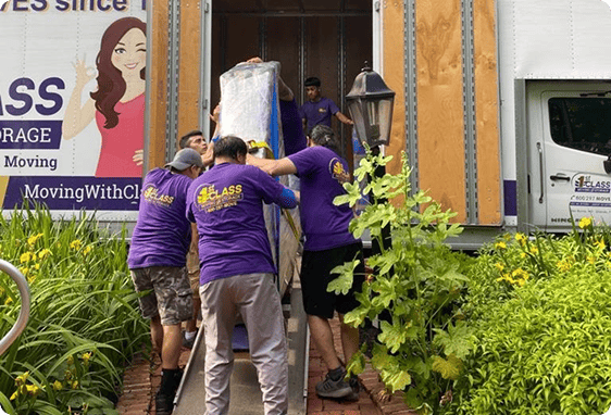 Moving crew carrying furniture